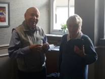 A group of men standing together

Description automatically generated