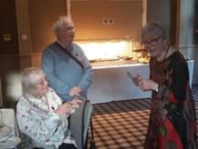 A group of old people sitting on a bed

Description automatically generated