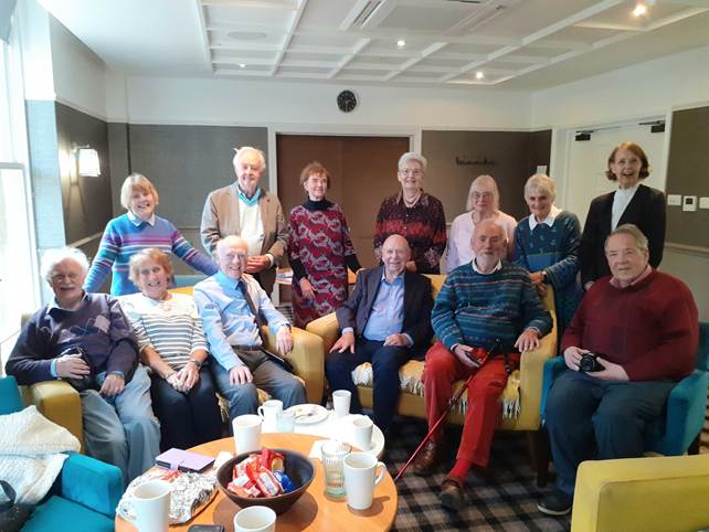 A group of people posing for a photo

AI-generated content may be incorrect.