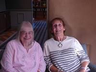 A couple of women sitting together

AI-generated content may be incorrect.