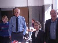 A group of people standing in a room

AI-generated content may be incorrect.